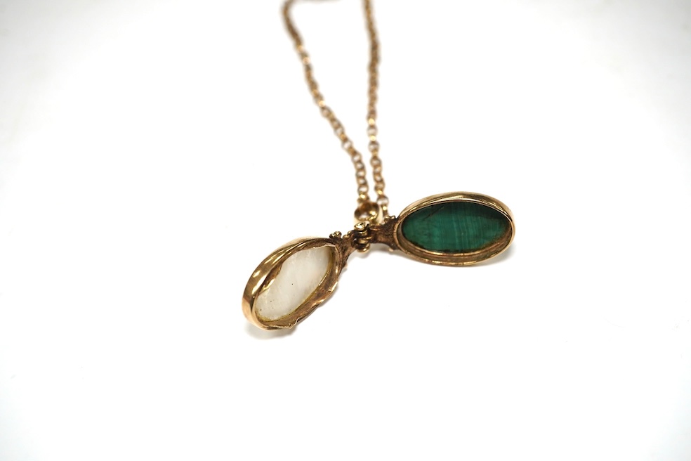 A modern yellow metal mounted malachite and mother of pearl set pendant, overall 43mm, on a 9ct gold chain, 60cm, gross weight 15.4 grams. Condition - fair